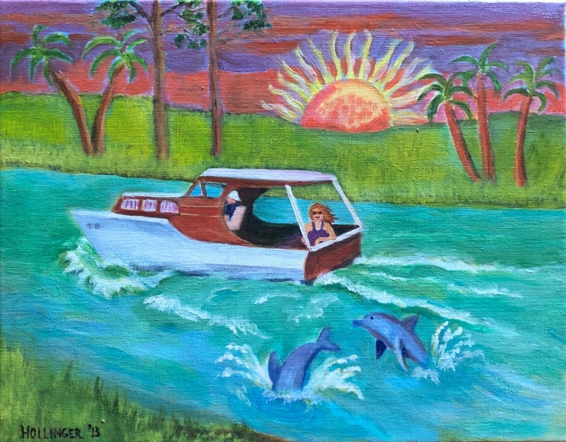 Classic Chriscraft boat with river dolphins boat and dolphins